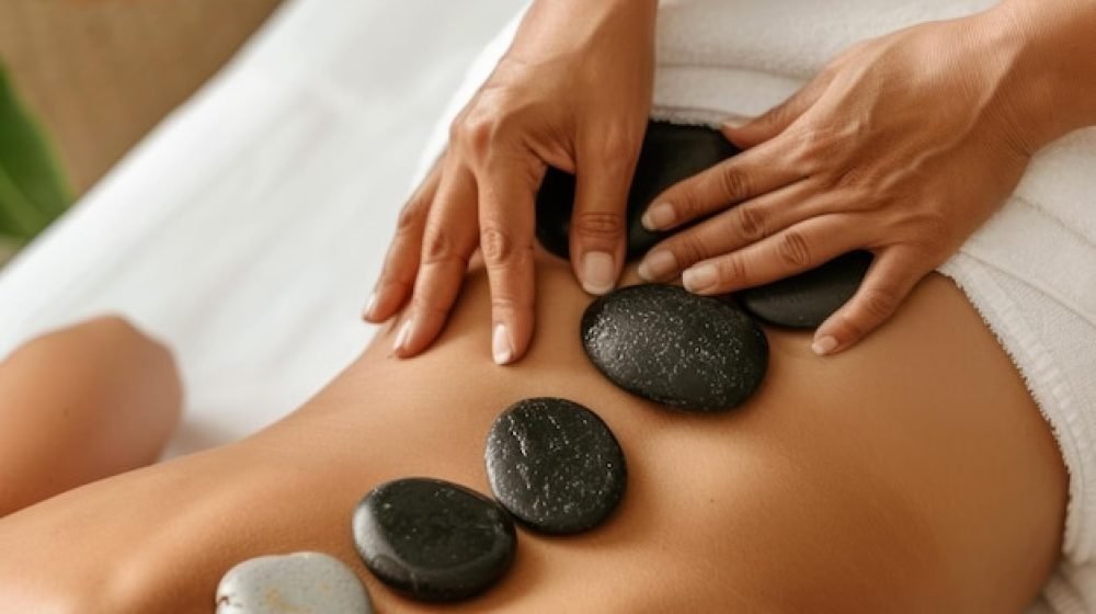 hot-stone-massage-therapy-session-hands-placing-smooth-stones-womans-back-spa-treatment-concept-promoting-relaxation-wellness_981050-13369